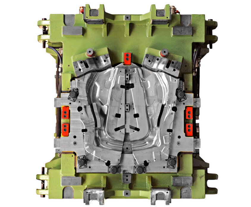 A green forming tool for the hot forming of reinforcements for A-pillars in vehicles, taken from a bird's eye view, illustrates weba's expertise in toolmaking and forming technology. 